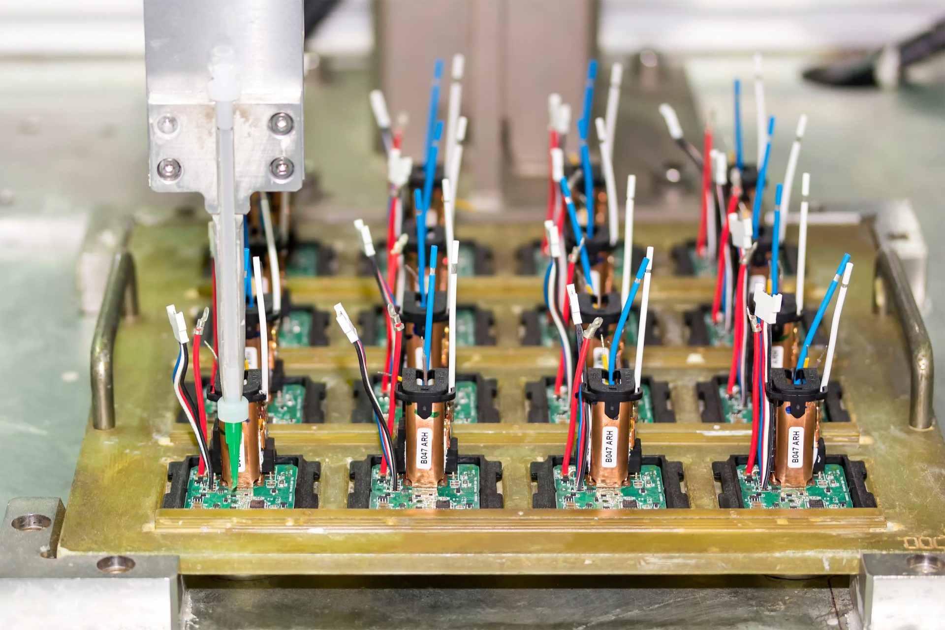 Close up High precision and technology of nozzle device and needle of automatic glue dispenser machine (glue injection) working on pcb in electronic factory